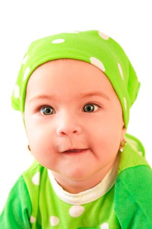 Beautiful baby girl dressed in greenの写真素材