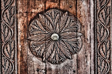 Old Romanian wooden carved doorの写真素材