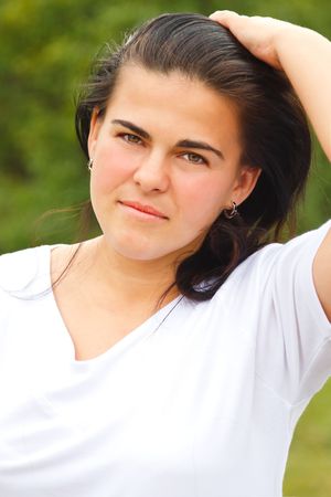 Portrait of a beautiful young woman outdoor.の写真素材