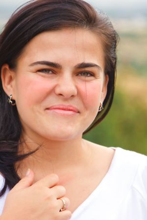 Portrait of a beautiful young woman outdoor.の写真素材