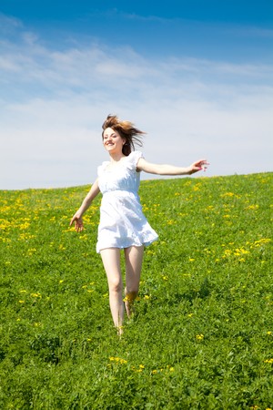Young woman enjoying the nature in a warm spring dayの写真素材