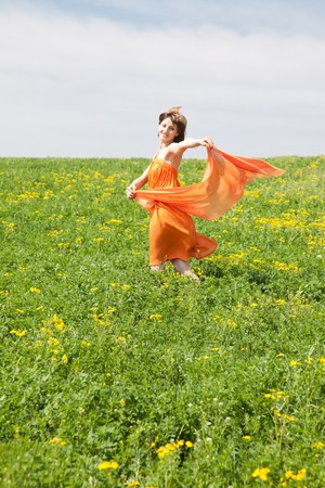 Beautiful young woman enjoying a sunny day of spring in the natureの写真素材