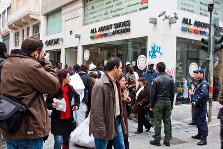 Athens, Greece - February 2010: Immigrants selling counterfeit goods running from the police in downtownのeditorial素材