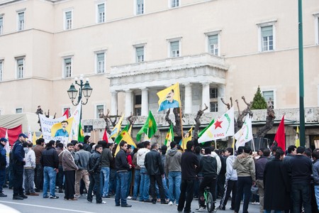 Athens, Greece - February 2010: Kurdish protestors walking through downtown  with bannersのeditorial素材