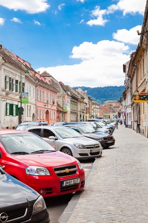 BRASOV, ROMANIA - JULY 30: Street with tourists in the historical part of the downtown on July 30, 2010 in Brasov, Romania. In 2010 Brasov turns 775 years from historical attestation.のeditorial素材
