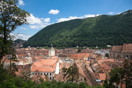 BRASOV, ROMANIA - JULY 30: The old city seen from White Tower on July 30, 2010 in Brasov, Romania. In 2010 Brasov turns 775 years from historical attestation.のeditorial素材
