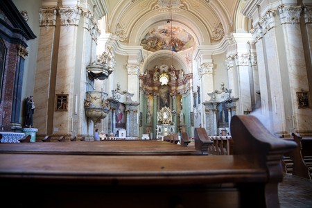 LIPOVA, ROMANIA - AUGUST 20: Tourists visiting the interior of Maria Radna Franciscan Monastery on August 20, 2010 in Lipova, Romania. Built in 1756 the church attracts many tourists every year.のeditorial素材