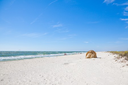 VADU, ROMANIA - AUGUST 28: The Black Sea wild beach at Vadu on August 28, 2010 in Vadu, Romania. One of the last wild beaches, part of the Biosphere Reserve of Danube Delta the beach is threatened by residential constructors.のeditorial素材
