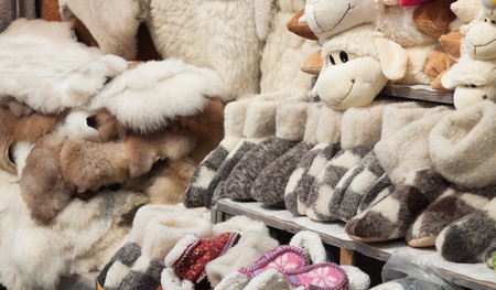Handmade shoes made of fur at a souvenir shop in Romania.の写真素材