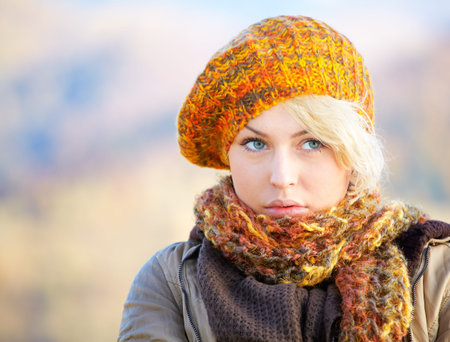 Portrait of a pensive young woman outdoor in the countryside.