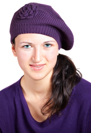 Portrait of a beautiful teenage girl wearing purple hat and top の写真素材