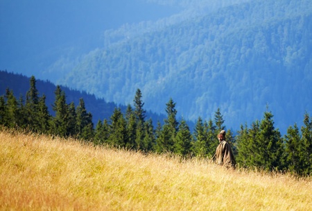CARAS-SEVERIN, ROMANIA - AUGUST 18  Old shepherd high in the Carpathian Mountains during the period of transhumance on August 18, 2011 in Tarcu Mountains, Romania  Transhumance is a very old Romanian tradition の写真素材