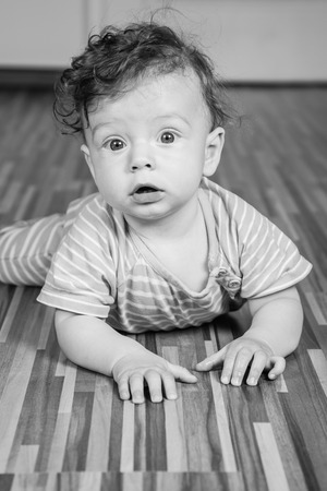 Portrait of a 7 months old baby boy at home.の写真素材
