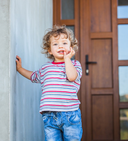 Portrait of 1 year old baby boy sucking his finger.の写真素材