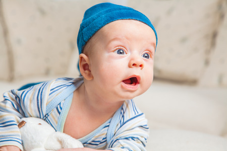 Cute 2 months old baby boy at home on the sofa.の写真素材