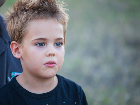Portrait of a 5 year old boy outdoor in the countryside.の写真素材
