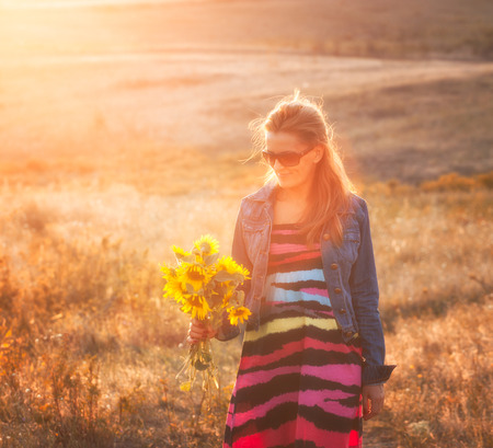 Beautiful woman portrait enjoying a day outdoors.の写真素材