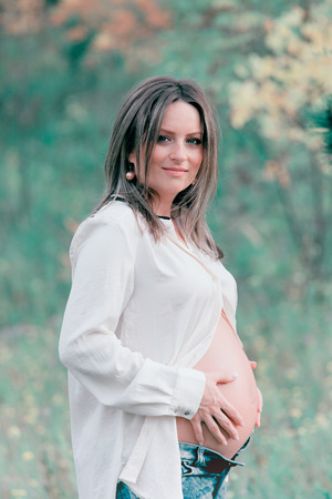 Portrait of a beautiful pregnant woman outdoor.の写真素材