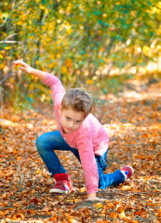 5 year old boy portrait outdoor in autumn.の写真素材