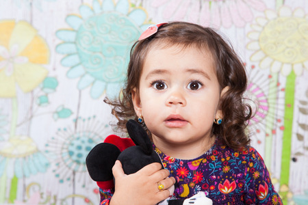 Portrait of 1 and a half gorgeous baby girl indoor.の写真素材