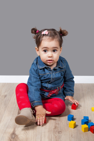 Portrait of 1 and a half gorgeous baby girl indoor.の写真素材