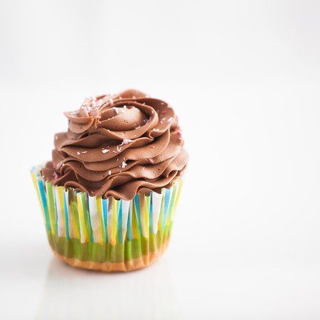 Chocolate cupcakes, homemade, over white background.の写真素材