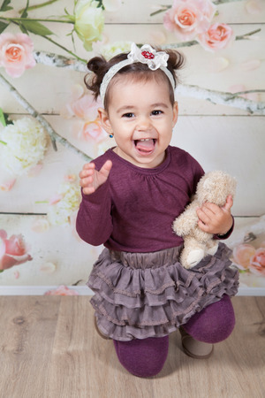 Portrait of 1 and a half gorgeous baby girl indoor.の写真素材