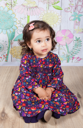 Portrait of 1 and a half gorgeous baby girl indoor.の写真素材