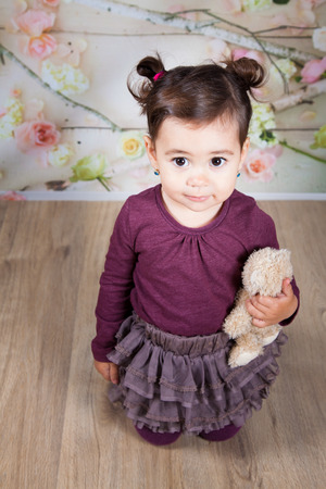 Portrait of 1 and a half gorgeous baby girl indoor.の写真素材
