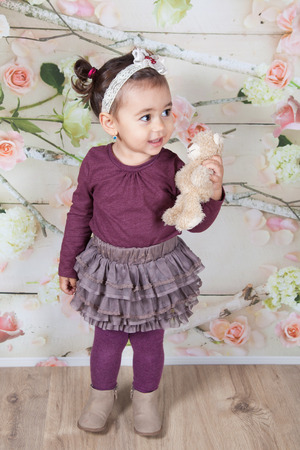 Portrait of 1 and a half gorgeous baby girl indoor.の写真素材