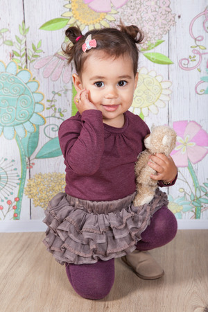 Portrait of 1 and a half gorgeous baby girl indoor.の写真素材