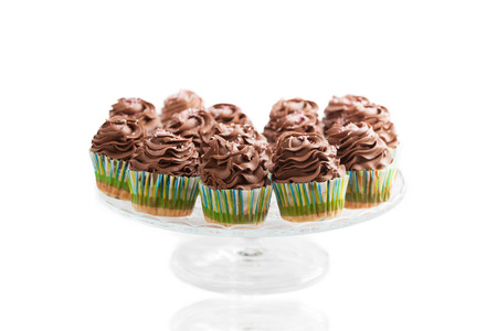 Chocolate cupcakes, homemade, over white background.の写真素材