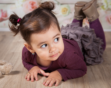 Portrait of 1 and a half gorgeous baby girl indoor.の写真素材