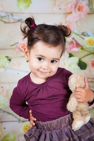 Portrait of 1 and a half gorgeous baby girl indoor.の写真素材