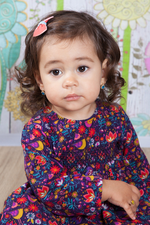 Portrait of 1 and a half gorgeous baby girl indoor.の写真素材