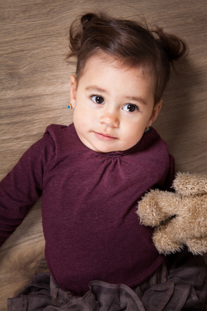 Portrait of 1 and a half gorgeous baby girl indoor.の写真素材