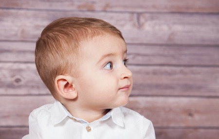 Portrait of 1 year old baby boy, Christmas theme, studio shot.の写真素材