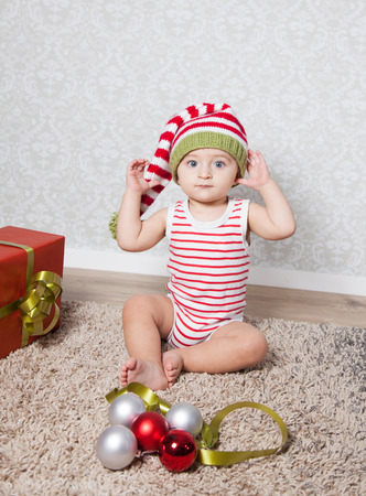 Portrait of 1 year old baby boy, Christmas theme, studio shot.の写真素材