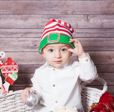 Portrait of 1 year old baby boy, Christmas theme, studio shot.の写真素材