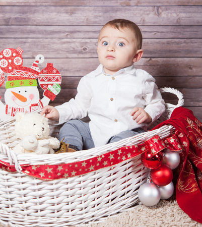 Portrait of 1 year old baby boy, Christmas theme, studio shot.の写真素材