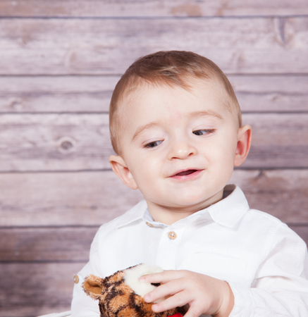 Portrait of 1 year old baby boy, Christmas theme, studio shot.の写真素材