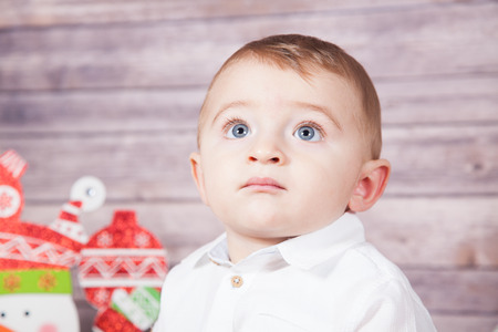 Portrait of 1 year old baby boy, Christmas theme, studio shot.の写真素材