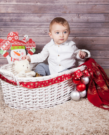 Portrait of 1 year old baby boy, Christmas theme, studio shot.の写真素材