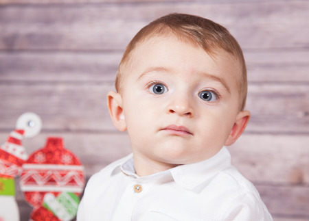Portrait of 1 year old baby boy, Christmas theme, studio shot.の写真素材