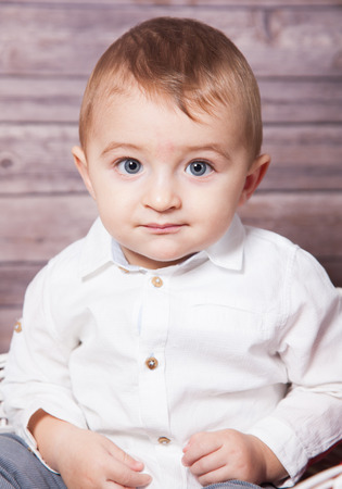 Portrait of 1 year old baby boy, Christmas theme, studio shot.の写真素材