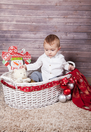 Portrait of 1 year old baby boy, Christmas theme, studio shot.の写真素材