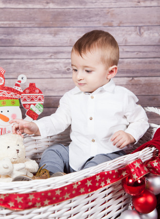 Portrait of 1 year old baby boy, Christmas theme, studio shot.の写真素材