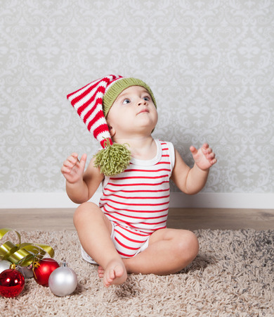 Portrait of 1 year old baby boy, Christmas theme, studio shot.の写真素材
