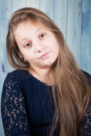 Portrait of a 10 year old girl, studio shot.の写真素材