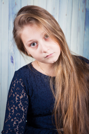 Portrait of a 10 year old girl, studio shot.の写真素材